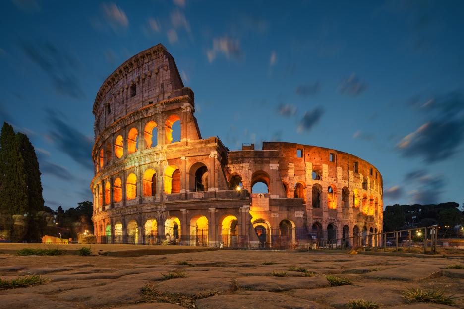 The Colosseum in Rome at night, illuminated.