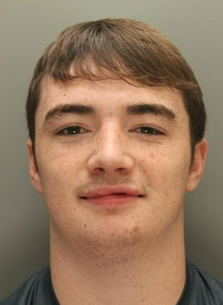 Mugshot of Eddie Burton, a young man with brown hair and freckles.