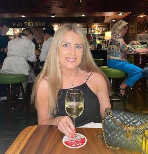 Simone White, a British lawyer, at a bar in Laos.