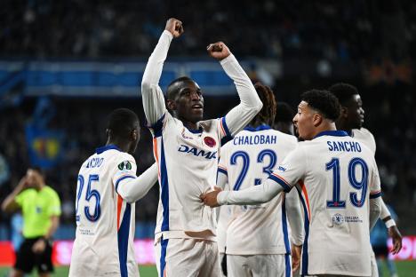 Chelsea FC players celebrating a goal.