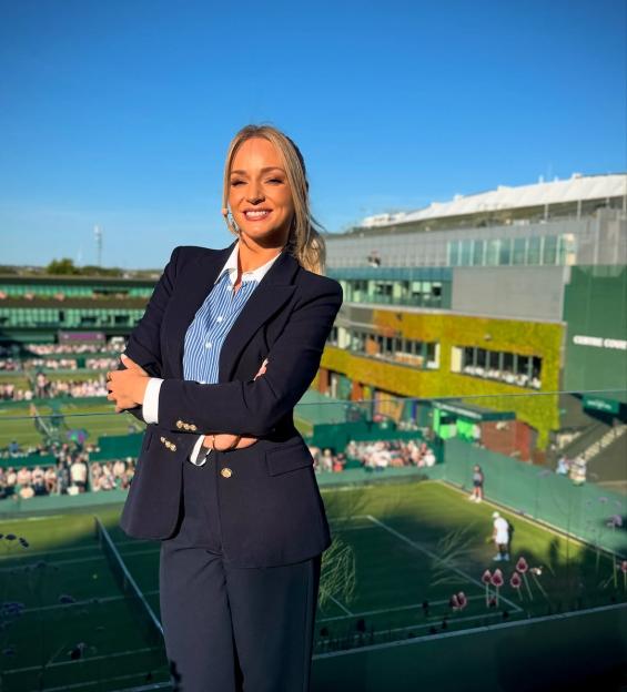 Woman in suit at Wimbledon.