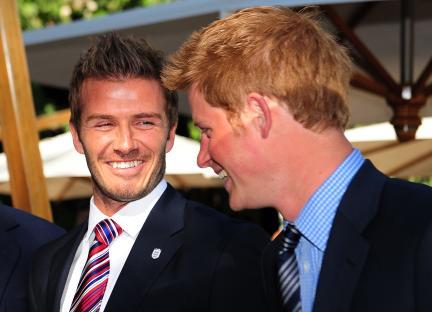 Prince Harry and David Beckham smiling together.