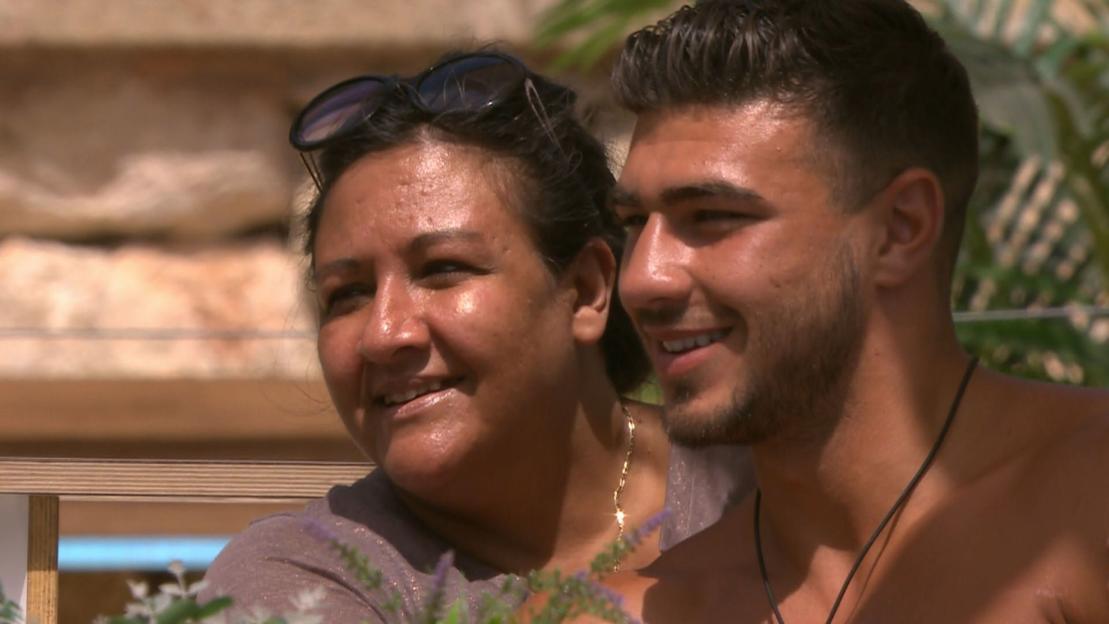 A man and woman smiling together.