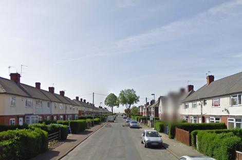 Street view of terraced houses.