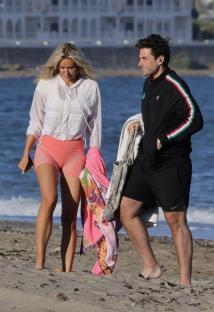James Argent and Nicoline Artursson on a beach.