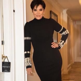 Kris Jenner in a black, jeweled dress.