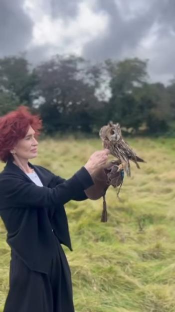 Sharon Osbourne holding an owl.