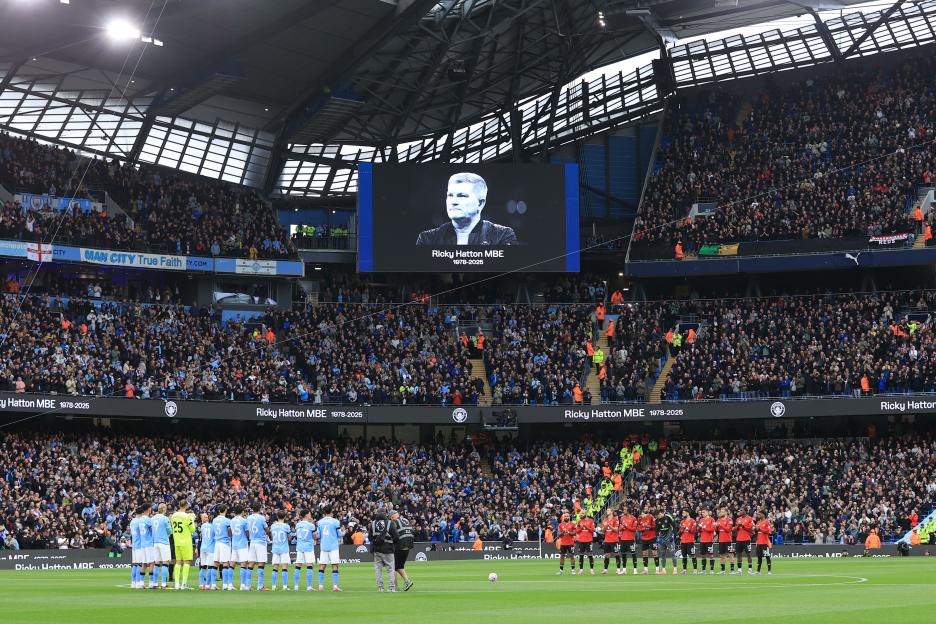 Players line up to respect the memory of boxer Ricky Hatton before a Premier League match.