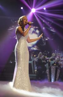 Lucie Jones singing on stage during The X Factor.