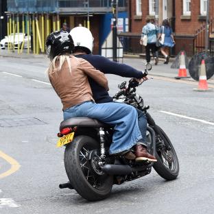 Helen Skelton and Gethin Jones on a motorcycle.