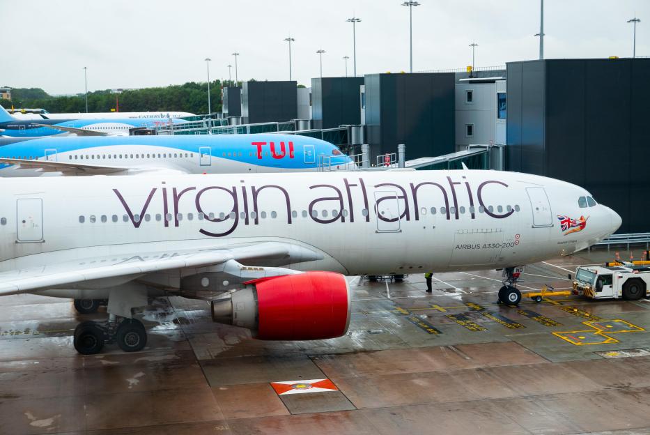 Virgin Atlantic Airbus A330-200, TUI, and Cathay Pacific planes at an airport.