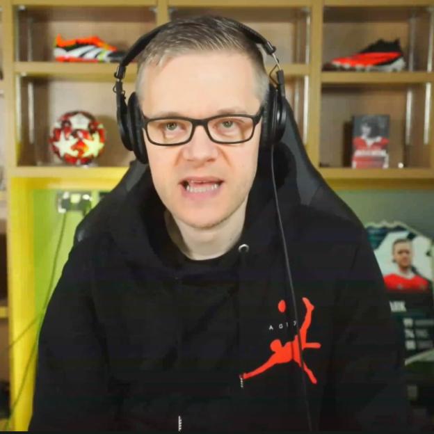 Mark Goldbridge wearing headphones.