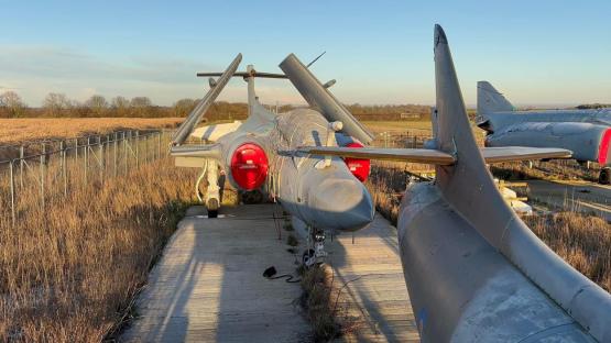 Rotting Hawker Hunter jet in a UK ex-military plane graveyard.
