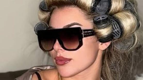 Glam footballer Madelene Wright puts on busty display in bra and open shirt as she plugs her OnlyFans