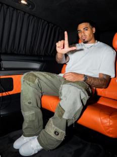 Man in a car making the 