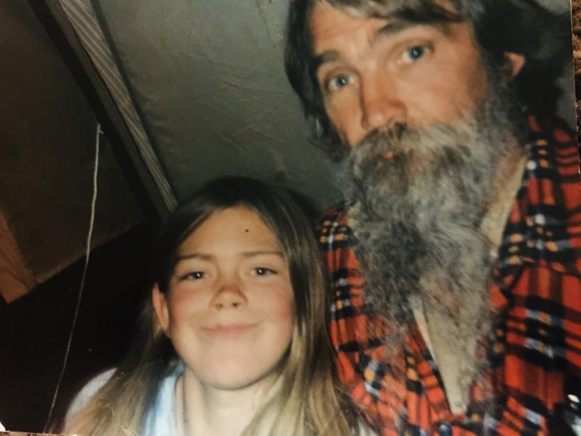 Photo of a man with a long beard and a young girl.