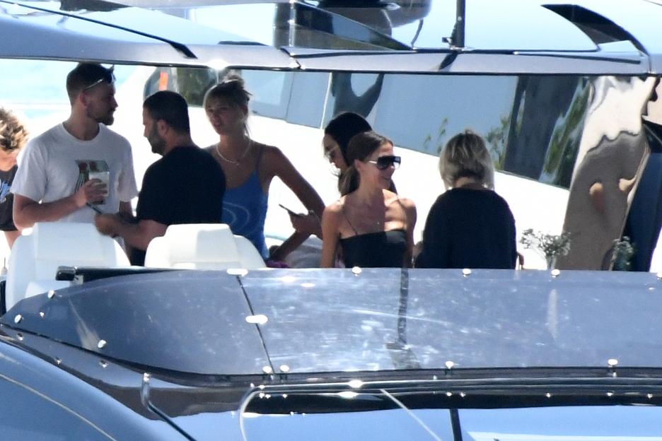 David and Victoria Beckham with friends on a yacht.