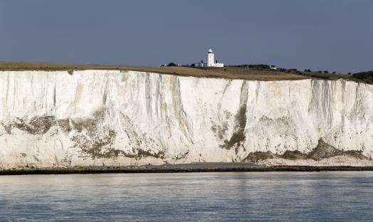 White cliffs of Dover with a lighthouse.