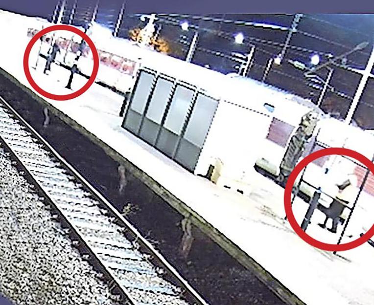 CCTV footage of a knifeman following screaming passengers at a train station.
