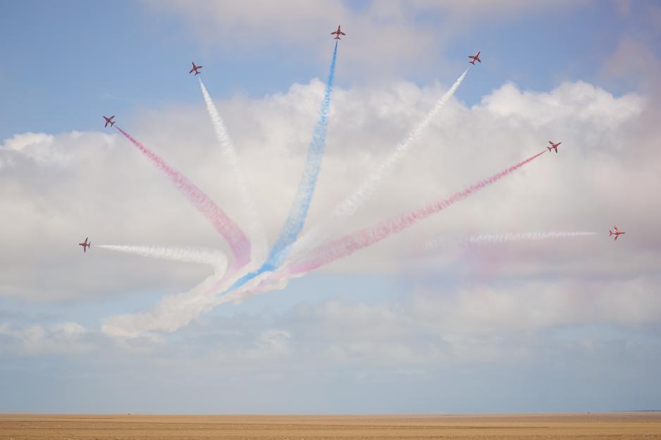 The Red Arrows aerobatic display team performing at an airshow.