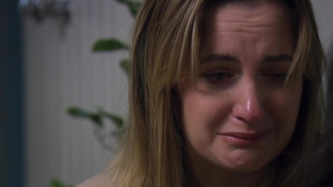 Close-up of a woman crying.
