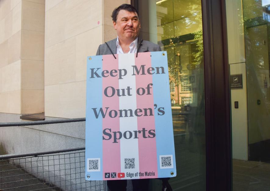 Mandatory Credit: Photo by Vuk Valcic/SOPA Images/Shutterstock (15471035f) Graham Linehan stands with a 'Keep men out of women's sports' placard as he arrives at Westminster Magistrates Court for his trial. The comedy writer, best known for TV shows Father Ted and The IT Crowd, is accused of harassing a transgender woman and damaging her phone. Father Ted creator Graham Linehan arrives at Westminster Magistrates Court, London, UK - 04 Sept 2025