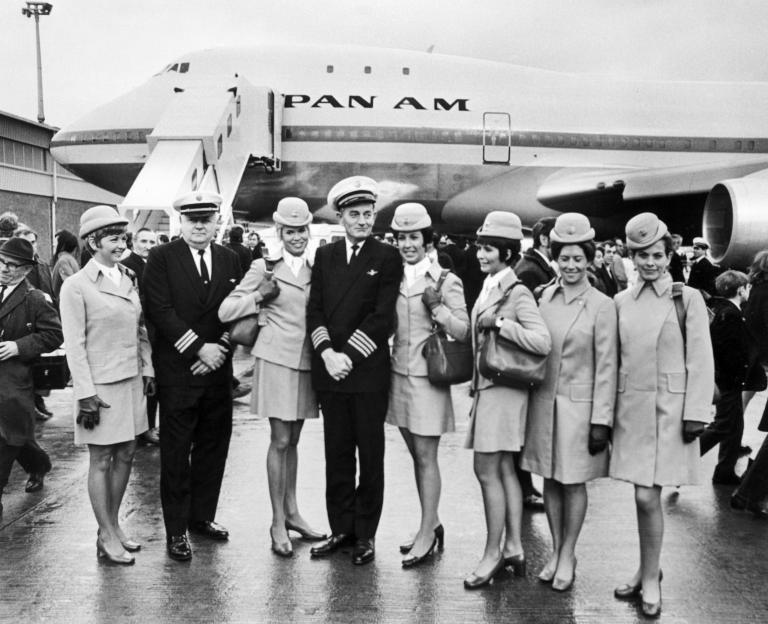 Black and white group photo of the Pan Am crew in front of a Boeing 747.