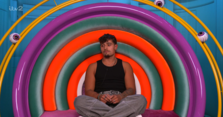 Big Brother star Caroline looking upset in the Big Brother chair.