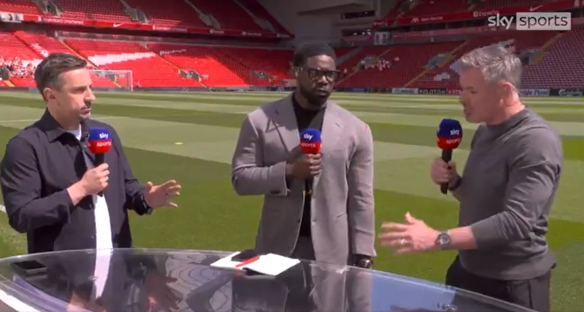 Three sportscasters giving a report at a stadium.