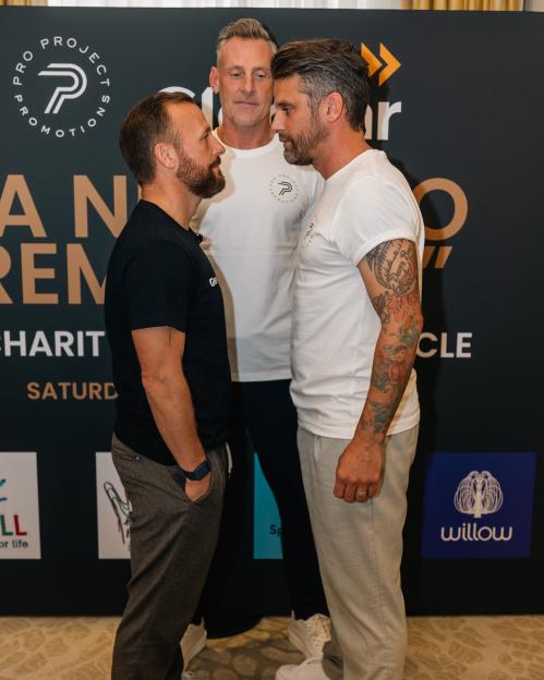 Jody Morris and David Bentley facing each other, with a third man standing between and behind them.