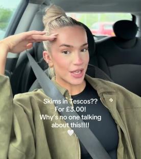 Woman in car reviewing inexpensive underwear.