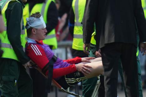 Injured soccer player being carried on a stretcher.