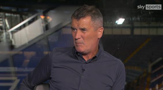 Man in dark shirt during interview.