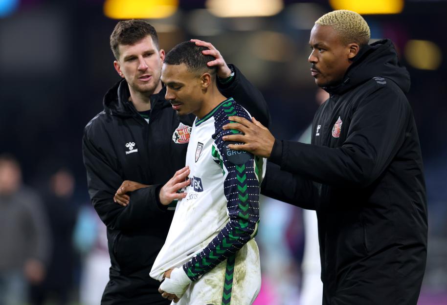 Sunderland's Wilson Isidor consoled by teammates after a match.
