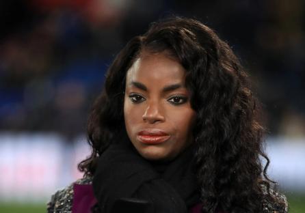 Eni Aluko holding a Premier League microphone.