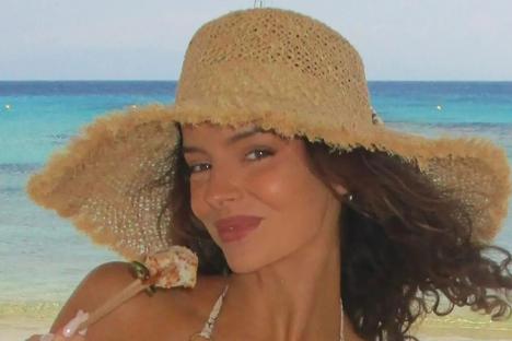 Maura Higgins stuns in a bikini as she lounges on the beach after being confirmed for huge reality show