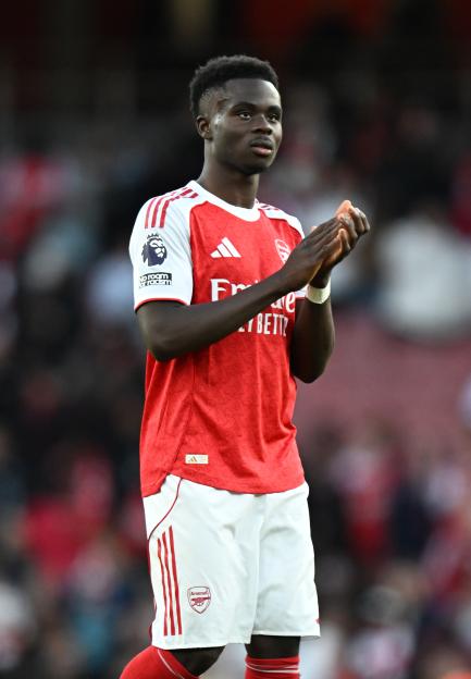 Bukayo Saka of Arsenal applauds the fans.