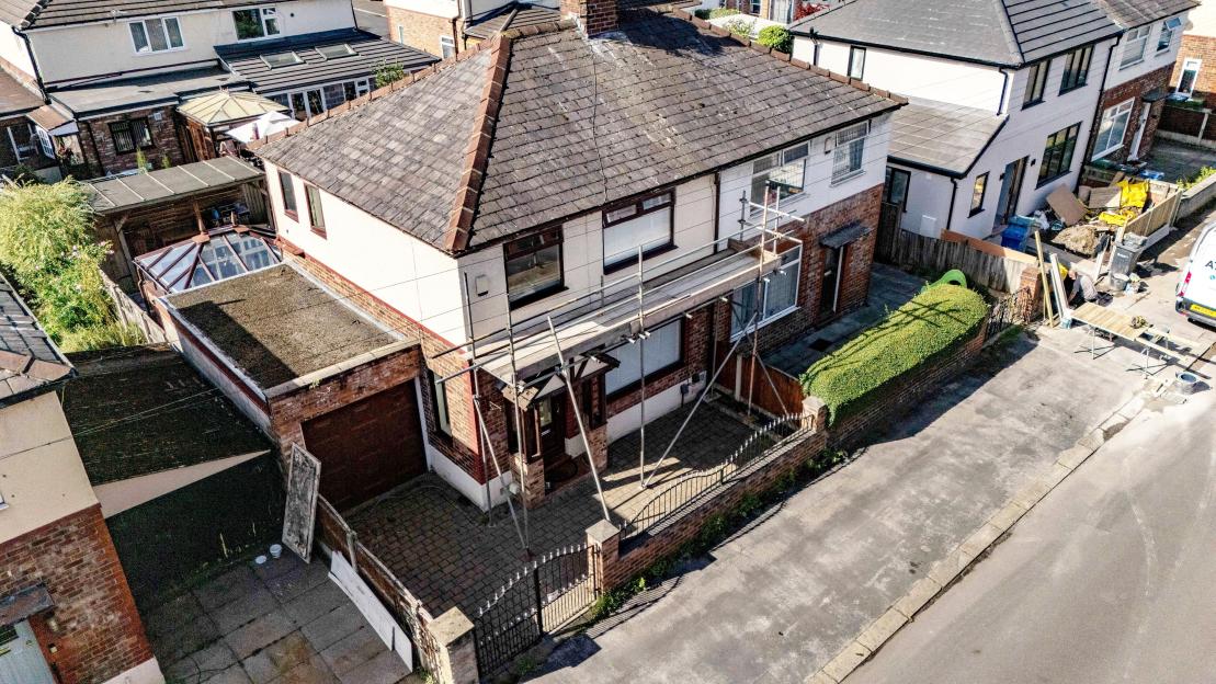 Aerial view of a house with scaffolding.