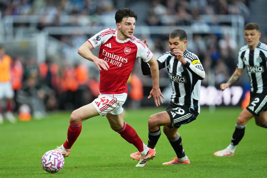 Arsenal's Declan Rice challenges for the ball with Newcastle's Bruno Guimaraes.