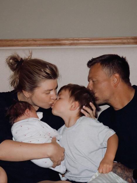Family photo of Olivia and Alex Bowen with their two children; a newborn baby and a toddler.