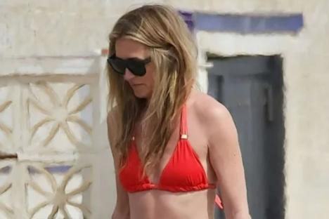 Cat Deeley, 48, looks amazing in coral bikini as she soaks up the sun on break from This Morning