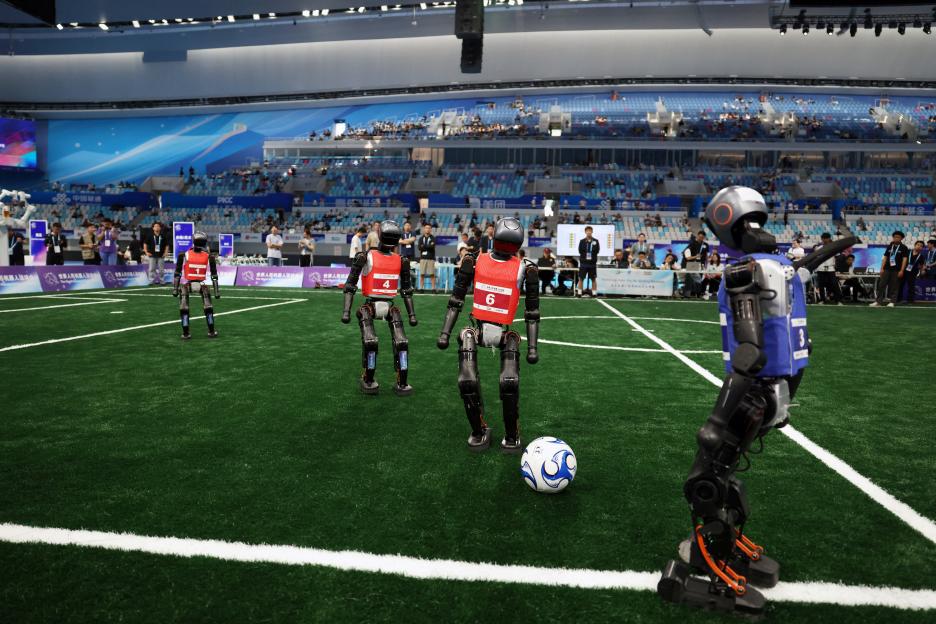 Humanoid robots playing soccer.