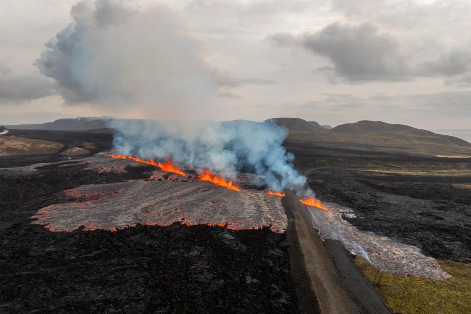 Volcano erupts on Iceland with magma spewing from huge new fissure as tourists evacuated from popular hols resort