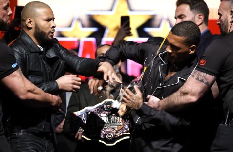 Chris Eubank Jr. throws an egg at Conor Benn during a press conference.