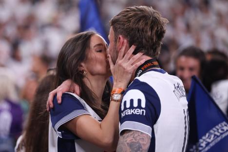 James Maddison of Tottenham Hotspur kissing his girlfriend after a soccer game.