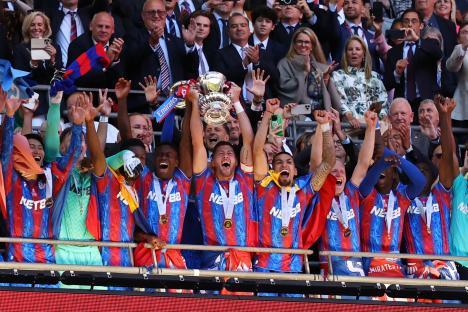 Crystal Palace players celebrating with a trophy.