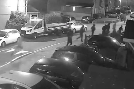 CCTV footage of masked men attacking a home.