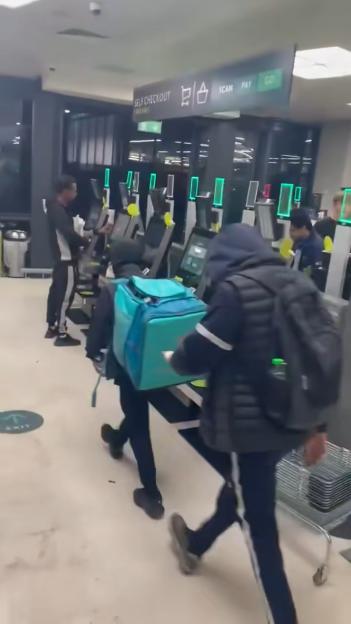 Video grab showing thieves robbing a store.