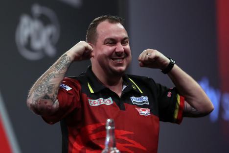 Kim Huybrechts of Belgium celebrates a darts win.