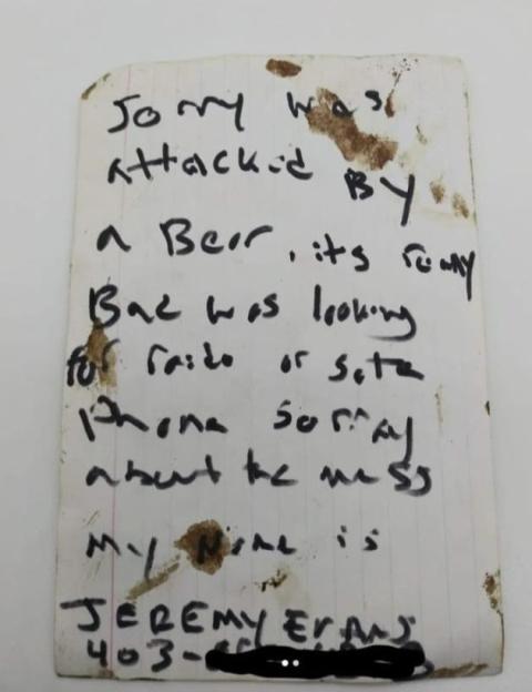 Handwritten note about a bear attack.